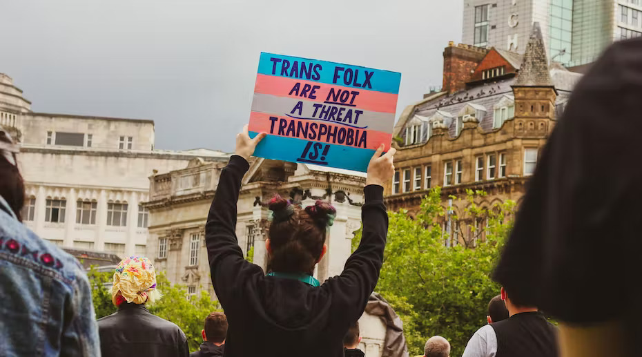 Pro-transgender rights signs at a protest rally